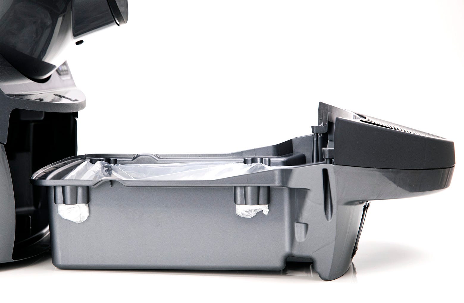 Wrapping the edges of the Litter-Robot 3 Liner over the rim of the waste drawer