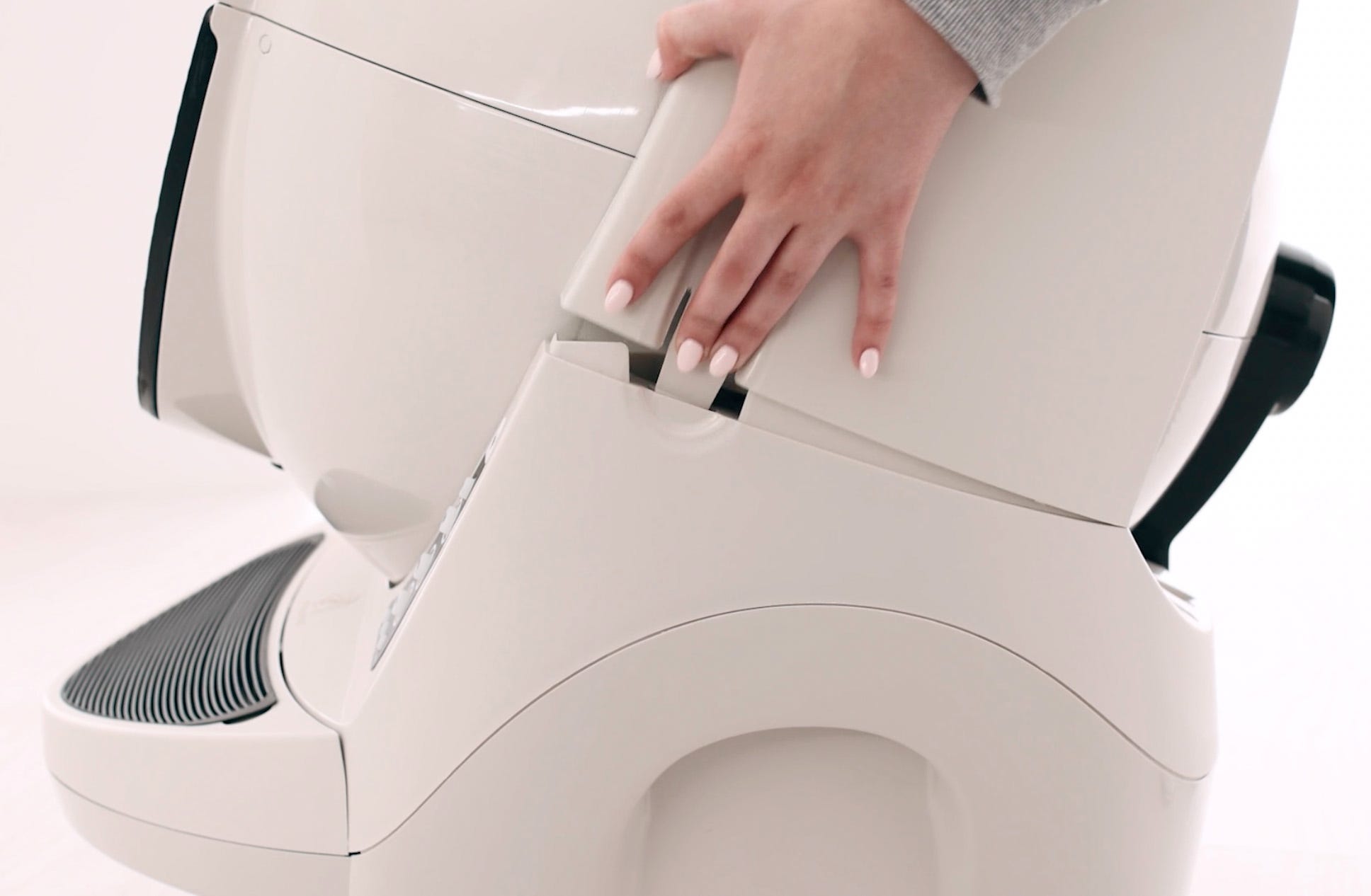 side tabs on Litter-Robot 3 to remove the bonnet
